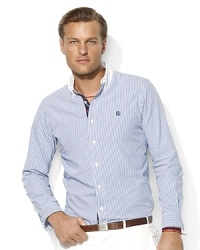 A trim-fitting long-sleeved sport shirt is tailored from soft oxford-woven cotton with sleek stripes for a timeless look. A trim-fitting long-sleeved sport shirt is tailored from soft oxford-woven cotton with sleek stripes for a timeless look.