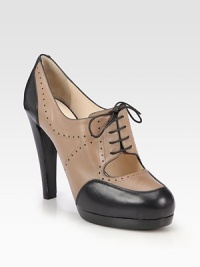 A platform leather pump is freshened with a skin-baring cutout, topped with round laces and traditional perforated details. Self-covered heel, 4¾ (120mm)Stacked platform, 1 (25mm)Compares to a 3¾ heel (95mm)Leather upperLeather liningLeather and rubber solePadded insoleMade in Italy A platform leather pump is freshened with a skin-baring cutout, topped with round laces and traditional perforated details. Self-covered heel, 4¾ (120mm)Stacked platform, 1 (25mm)Compares to a 3¾ heel (95mm)Leather upperLeather liningLeather and rubber solePadded insoleMade in Italy