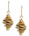 Glittering in gold. Kenneth Cole New York's graduated disc earrings shimmer in a gold tone mixed metal setting. Approximate drop: 1 inch.