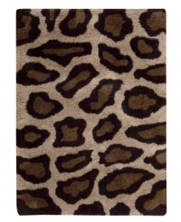 Exotic designs will be the pride of your decor. Adorned with leopard spots in beige and black, this Nourison rug has a marvelously soft and shaggy pile that's hand-tufted from premium-quality yarns. Beautiful in appearance and plush underfoot, this area rug creates an atmosphere of casual elegance. (Clearance) Exotic designs will be the pride of your decor. Adorned with leopard spots in beige and black, this Nourison rug has a marvelously soft and shaggy pile that's hand-tufted from premium-quality yarns. Beautiful in appearance and plush underfoot, this area rug creates an atmosphere of casual elegance. (Clearance)