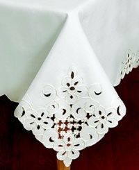 Swirling blooms embroidered in white or gold cut beautifully into the Lancelot tablecloth for decor in need of old-world elegance. A scalloped edge echoes the classic motif as it scrolls from corner to corner and around the center of your table. Swirling blooms embroidered in white or gold cut beautifully into the Lancelot tablecloth for decor in need of old-world elegance. A scalloped edge echoes the classic motif as it scrolls from corner to corner and around the center of your table.