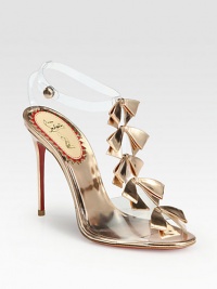 Sexy translucent PVC forms this t-strap silhouette lined with petite metallic leather bows. Metallic leather-covered heel, 4 (100mm)Metallic leather and PVC upperAnkle strap with snap closureMetallic leather liningSignature red leather solePadded insoleMade in Italy Sexy translucent PVC forms this t-strap silhouette lined with petite metallic leather bows. Metallic leather-covered heel, 4 (100mm)Metallic leather and PVC upperAnkle strap with snap closureMetallic leather liningSignature red leather solePadded insoleMade in Italy