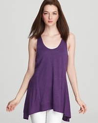 A fluttery dipped hem lends movement to this Eileen Fisher tunic. Team with skinnies and a bold pump for a night out. A fluttery dipped hem lends movement to this Eileen Fisher tunic. Team with skinnies and a bold pump for a night out.
