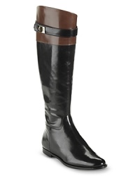 Cole Haan injects tall, polished riding boots with versatile style; pair them with black or neutrals thanks to contrast trim. Cole Haan injects tall, polished riding boots with versatile style; pair them with black or neutrals thanks to contrast trim.