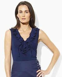 A cascade of ruffles exudes feminine style in our Stu sleeveless top, fashioned from sleek jersey. A cascade of ruffles exudes feminine style in our Stu sleeveless top, fashioned from sleek jersey.