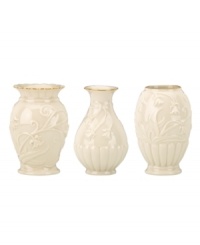 Lenox combines ivory porcelain sculpted with graceful blooms, elegant fluting and touches of gold in this trio of classically styled Floral Melody posy vases. Lenox combines ivory porcelain sculpted with graceful blooms, elegant fluting and touches of gold in this trio of classically styled Floral Melody posy vases.