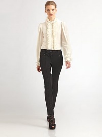 Sumptuous silk, tailored in a classic button-down style with a flurry of ruffles on the collar, cuffs and button placket.Ruffled stand collarLong puff sleeves with buttoned, ruffled cuffsButton frontBack pleats at yokeAbout 25 from shoulder to hemSilkDry cleanMade in Italy of imported fabric Model shown is 5'10 wearing US size 4. Sumptuous silk, tailored in a classic button-down style with a flurry of ruffles on the collar, cuffs and button placket.Ruffled stand collarLong puff sleeves with buttoned, ruffled cuffsButton frontBack pleats at yokeAbout 25 from shoulder to hemSilkDry cleanMade in Italy of imported fabric Model shown is 5'10 wearing US size 4.