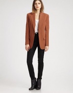 The single-breasted blazer, impeccably tailored in an oversized silhouette that boasts defined shoulders and a nipped waist.Notch collarWelt pocketsBodice dartsSingle button closureHip flap pocketsDouble back ventsAbout 29 from shoulder to hemCottonDry cleanImportedModel shown is 5'10 (177cm) wearing US size 4.