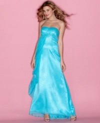 Be the belle of the ball in this gown from Jump that features scattered rhinestone embellishments and a sweeping chiffon overlay! Be the belle of the ball in this gown from Jump that features scattered rhinestone embellishments and a sweeping chiffon overlay!