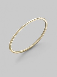 A unique bangle of 18k gold, polished on the outside with a twisted Yurman cable on the inside. 18k yellow gold Diameter, about 2½ Made in USA A unique bangle of 18k gold, polished on the outside with a twisted Yurman cable on the inside. 18k yellow gold Diameter, about 2½ Made in USA