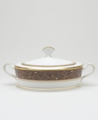 Add drama to your tabletop with this bold pattern from Noritake! Strikingly elegant, this bone china features a rich gold and red brocade border adorned with soft ivory dots and a gold band. Add drama to your tabletop with this bold pattern from Noritake! Strikingly elegant, this bone china features a rich gold and red brocade border adorned with soft ivory dots and a gold band.