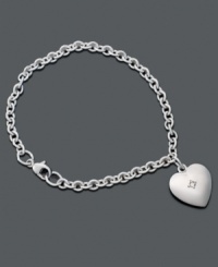 Let her discover the fun of jewelry with this sterling silver bracelet. Heart charm features single diamond accent at center. Approximate length: 6-1/4 inches. Approximate drop of charm: 1/2 inch. Let her discover the fun of jewelry with this sterling silver bracelet. Heart charm features single diamond accent at center. Approximate length: 6-1/4 inches. Approximate drop of charm: 1/2 inch.