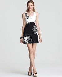 Featuring a chic black and white print, this Oonagh by Nanette Lepore dress is the perfect choice for your upcoming party--day-chic with cutouts at the sides and a slightly flared skirt for a hint of retro inspiration. Featuring a chic black and white print, this Oonagh by Nanette Lepore dress is the perfect choice for your upcoming party--day-chic with cutouts at the sides and a slightly flared skirt for a hint of retro inspiration.