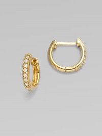 Versatile hoops of 18k yellow gold are richly set with sparkling diamonds, to wear on their own or pair with your favorite dangly charms. Diamonds, 0.11 tcw 18k yellow gold Diameter, about ½ Pierced Imported Please note: charms sold separately. Versatile hoops of 18k yellow gold are richly set with sparkling diamonds, to wear on their own or pair with your favorite dangly charms. Diamonds, 0.11 tcw 18k yellow gold Diameter, about ½ Pierced Imported Please note: charms sold separately.