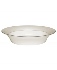 Dress up any veggies or sides with this fine china serving dish. From innovative designer Monique Lhullier, it features a pearlescent border with glossy raised dots and a fine stitch-like pattern. Dress up any veggies or sides with this fine china serving dish. From innovative designer Monique Lhullier, it features a pearlescent border with glossy raised dots and a fine stitch-like pattern.