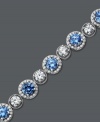 Perfect your party look with plenty of shine. Arabella's glamorous tennis bracelet combines round-cut blue and white Swarovski zirconias (22-9/10 ct. t.w.) for a look that's completely brilliant. Crafted in sterling silver. Approximate length: 7 inches.