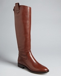 These KORS Michael Kors riding boots are absolutely perfectly polished, finished off with equestrian-inspired tab details. These KORS Michael Kors riding boots are absolutely perfectly polished, finished off with equestrian-inspired tab details.