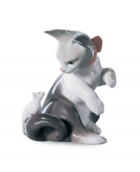 Watch the classic game of cat and mouse unfold with this irresistible figurine, handcrafted in premium Lladro porcelain. Watch the classic game of cat and mouse unfold with this irresistible figurine, handcrafted in premium Lladro porcelain.