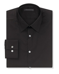 Solid dress shirt with spread collar, two button mitered cuffs. Contemporary fit through the body. Solid dress shirt with spread collar, two button mitered cuffs. Contemporary fit through the body.