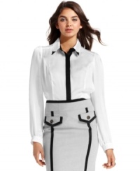A new take on black-and-white style! Eye-catching accents create perfect design on this inspired top from XOXO. A new take on black-and-white style! Eye-catching accents create perfect design on this inspired top from XOXO.