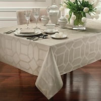 Suitable for either casual or refined entertaining, this tablecloth is the centerpiece of the Tile collection. Elegant cotton covering embellished with a geometric print of patterned tiles allover. Suitable for either casual or refined entertaining, this tablecloth is the centerpiece of the Tile collection. Elegant cotton covering embellished with a geometric print of patterned tiles allover.