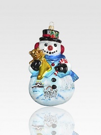 A top-hatted snowman adorned with charming Russian scenes has dazzling touches of glitter and gold atop his mouth-blown, hand-painted form.Glass6.25H X 3.5W X 3.5DImported A top-hatted snowman adorned with charming Russian scenes has dazzling touches of glitter and gold atop his mouth-blown, hand-painted form.Glass6.25H X 3.5W X 3.5DImported