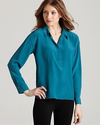 A vibrant jewel tone ignites a sumptuous Eileen Fisher silk blouse for everyday elegance. Set off the shade with silver accents. A vibrant jewel tone ignites a sumptuous Eileen Fisher silk blouse for everyday elegance. Set off the shade with silver accents.