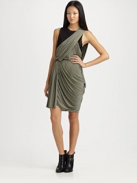 Supple jersey drapes asymmetrically in a dynamic two-tone design.Jewel necklineSleevelessDraped overlay at bodiceSet-in waistAsymmetrical skirtAbout 26 from natural waistBody: 94% cupro/6% elastane; overlay: 52% polyamide/35% silk/13% spandexDry cleanMade in Italy of imported fabric Supple jersey drapes asymmetrically in a dynamic two-tone design.Jewel necklineSleevelessDraped overlay at bodiceSet-in waistAsymmetrical skirtAbout 26 from natural waistBody: 94% cupro/6% elastane; overlay: 52% polyamide/35% silk/13% spandexDry cleanMade in Italy of imported fabric