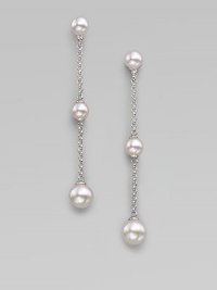 Graceful chains of sterling silver have round white pearls at the top, the bottom and in the middle as they dangle delicately. 6mm and 8mm white round organic man-made pearls Sterling silver Drop, about 2¾ Post back Made in Spain Graceful chains of sterling silver have round white pearls at the top, the bottom and in the middle as they dangle delicately. 6mm and 8mm white round organic man-made pearls Sterling silver Drop, about 2¾ Post back Made in Spain
