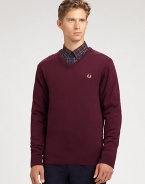 A practical pullover sweater with collegiate-inspired style effortlessly shaped in a warm blend of merino wool and cotton.V-neckRibbed knit collar, sleeves and hem54% merino wool/46% cottonDry cleanImported