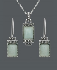 Express peace and tranquility in the form of pale, green hues. Cabochon jade stones (7 mm x 9 mm and 5 mm x 7 mm) make a serene statement when framed by the subtle glitter of marcasite. Genevieve & Grace set crafted in sterling silver. Approximate necklace length: 18 inches. Approximate pendant drop: 1 inch. Approximate earring drop: 1 inch. Express peace and tranquility in the form of pale, green hues. Cabochon jade stones (7 mm x 9 mm and 5 mm x 7 mm) make a serene statement when framed by the subtle glitter of marcasite. Genevieve & Grace set crafted in sterling silver. Approximate necklace length: 18 inches. Approximate pendant drop: 1 inch. Approximate earring drop: 1 inch.