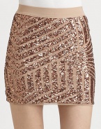 Stripes of sparkling sequins add a touch of graphic glam to this sleek, fitted mini.Elastic waistbandPull-on styleAbout 15 long80% polyester/20% spandexDry cleanImportedModel shown is 5'9½ (176cm) wearing US size Small.This style runs true to size. We recommend ordering your usual size for a standard fit. 