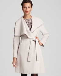 A shawl collar and belted wrap silhouette lend an effortless feel to this minimalist Calvin Klein Premium coat. Perfect for wrapping up in style on a blustery city day. A shawl collar and belted wrap silhouette lend an effortless feel to this minimalist Calvin Klein Premium coat. Perfect for wrapping up in style on a blustery city day.