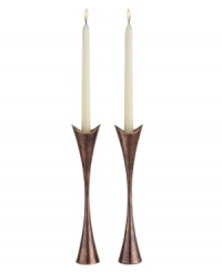Light up any setting with sophistication and allure. Crafted of alloy and finished in beautiful bronze, this Heritage Curve pair of candlesticks from Nambe adds old-world elegance and superior style to any setting. Light up any setting with sophistication and allure. Crafted of alloy and finished in beautiful bronze, this Heritage Curve pair of candlesticks from Nambe adds old-world elegance and superior style to any setting.