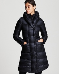 In a dark blue hue, this Armani Collezioni puffer keeps warm with a pure goose down fill. Stunning in its simplicity, this classic cold-weather coat lends style for years to come. In a dark blue hue, this Armani Collezioni puffer keeps warm with a pure goose down fill. Stunning in its simplicity, this classic cold-weather coat lends style for years to come.