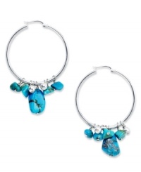 Classic hoops get a bohemian update. Avalonia Road's pretty style incorporates turquoise nuggets (2-1/5 ct. ct. t.w.) in a sleek hoop setting. Crafted in sterling silver. Approximate drop: 2-1/8 inches. Classic hoops get a bohemian update. Avalonia Road's pretty style incorporates turquoise nuggets (2-1/5 ct. ct. t.w.) in a sleek hoop setting. Crafted in sterling silver. Approximate drop: 2-1/8 inches.