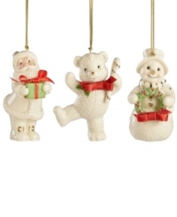A set of three happy-go-lucky ornaments decorate your tree, featuring Santa Claus, a teddy bear and a snowman with gold embellishments and red ribbon bows. Crafted of porcelain from Lenox. A set of three happy-go-lucky ornaments decorate your tree, featuring Santa Claus, a teddy bear and a snowman with gold embellishments and red ribbon bows. Crafted of porcelain from Lenox.