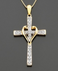 This diamond necklace with a diamond-encrusted cross (1/10 ct. t.w.) is ensconced within a gleaming gold heart. Set in 14k gold. Chain measures 16 inches. This diamond necklace with a diamond-encrusted cross (1/10 ct. t.w.) is ensconced within a gleaming gold heart. Set in 14k gold. Chain measures 16 inches.