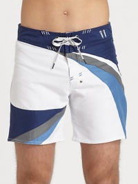 A charismatic, colorblocked design adorns this summer essential, in quick-drying nylon.Drawstring-tie waistInseam, about 7PolyesterMachine washImported A charismatic, colorblocked design adorns this summer essential, in quick-drying nylon.Drawstring-tie waistInseam, about 7PolyesterMachine washImported