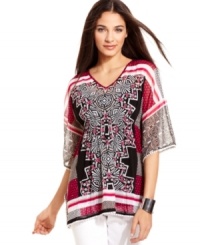 Rhinestones add a glam appeal to this boldly printed petite Alfani tunic -- perfect over leggings or skinny jeans! Rhinestones add a glam appeal to this boldly printed petite Alfani tunic -- perfect over leggings or skinny jeans!