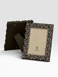 Swarovski crystals lend a twinkling effect to this oxidized platinum tone design. Holds 5 X 7 photoClassic beveled glassStretched leather backingGift boxedImported Swarovski crystals lend a twinkling effect to this oxidized platinum tone design. Holds 5 X 7 photoClassic beveled glassStretched leather backingGift boxedImported
