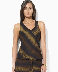 The chic earth tones on this printed silk georgette wrap blouse bring a breezy bohemian spirit to your warm-weather wardrobe. The chic earth tones on this printed silk georgette wrap blouse bring a breezy bohemian spirit to your warm-weather wardrobe.