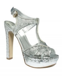 Viva glam! The Indrina platform sandals by GUESS are decked out with glittery shimmer and metallic shine. The super-high heel and platform add lift to your already dazzling look. Viva glam! The Indrina platform sandals by GUESS are decked out with glittery shimmer and metallic shine. The super-high heel and platform add lift to your already dazzling look.