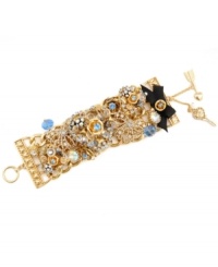 Start a conversation in this not-so-subtle style. Betsey Johnson's sparkling toggle bracelet combines detailed heart and flower charms combined with clear and blue crystal accents and a black grosgrain ribbon detail. Set in gold-plated mixed metal. Approximate length: 7-1/2 inches. Start a conversation in this not-so-subtle style. Betsey Johnson's sparkling toggle bracelet combines detailed heart and flower charms combined with clear and blue crystal accents and a black grosgrain ribbon detail. Set in gold-plated mixed metal. Approximate length: 7-1/2 inches.
