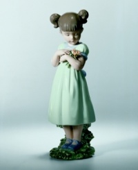 This sweet porcelain figurine depicts a little girl gathering posies for Mom. Porcelain. Makes a wonderful gift. 8.5 x 2.75. This sweet porcelain figurine depicts a little girl gathering posies for Mom. Porcelain. Makes a wonderful gift. 8.5 x 2.75.
