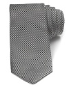 Patterned with bubble-like dots, this dapper tie invigorates your professional look with a dose of plush Italian silk.