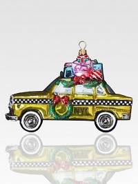 With packages piled high on its roof and a wreath hanging on the door, this charming ornament delivers a Big Apple Christmas greeting! Polonaise hand-blown glass About 5 high Made in Poland