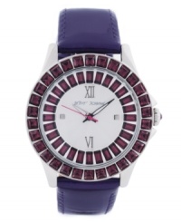 Dark crystal. Richly colored watch from Betsey Johnson crafted of purple leather strap and round polished stainless steel case. Bezel embellished with crystal accents. Silver tone textured dial features ring of baguette-cut crystal accents, gold tone Roman numerals at twelve and six o'clock, dot markers at three and six o'clock, gold tone hour and minute hands, signature fuchsia second hand and logo at twelve o'clock. Quartz movement. Water resistant to 30 meters. Two-year limited warranty. Dark crystal. Richly colored watch from Betsey Johnson crafted of purple leather strap and round polished stainless steel case. Bezel embellished with crystal accents. Silver tone textured dial features ring of baguette-cut crystal accents, gold tone Roman numerals at twelve and six o'clock, dot markers at three and six o'clock, gold tone hour and minute hands, signature fuchsia second hand and logo at twelve o'clock. Quartz movement. Water resistant to 30 meters. Two-year limited warranty.