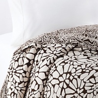 Keep it simple...or dress it up with color. This collection is white on black in a bold, abstract floral print. In a soft cotton, this set complements any modern bedroom. Keep it simple...or dress it up with color. This collection is white on black in a bold, abstract floral print. In a soft cotton, this set complements any modern bedroom.