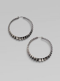Sterling silver hoops with black rhodium accents have a faceted zigzag pattern all around. Sterling silver and black rhodium Diameter, about 2½ Pierced Imported Sterling silver hoops with black rhodium accents have a faceted zigzag pattern all around. Sterling silver and black rhodium Diameter, about 2½ Pierced Imported